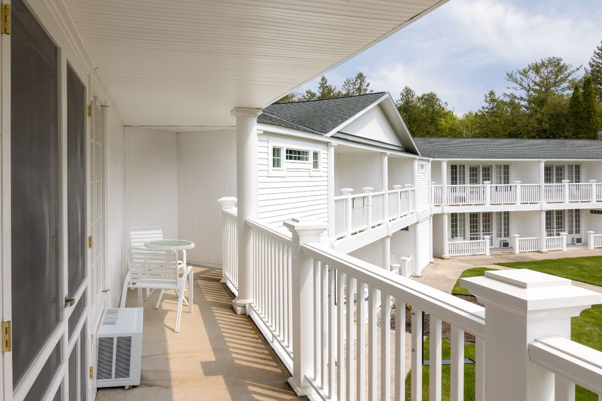 a white house with a white railing
