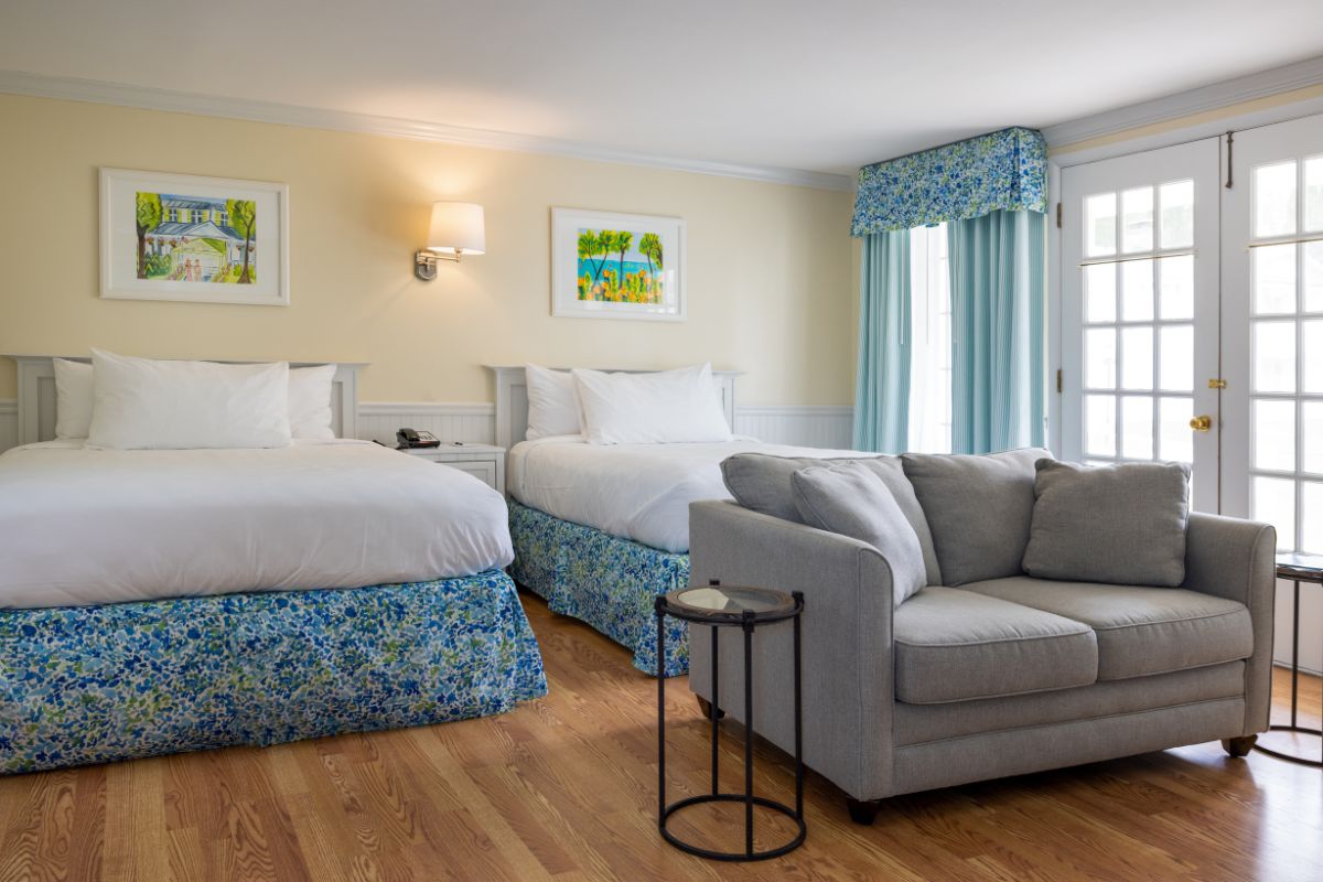 a room with two beds and a couch