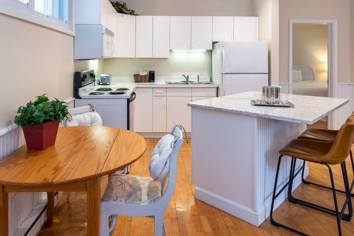 a kitchen with a table and chairs