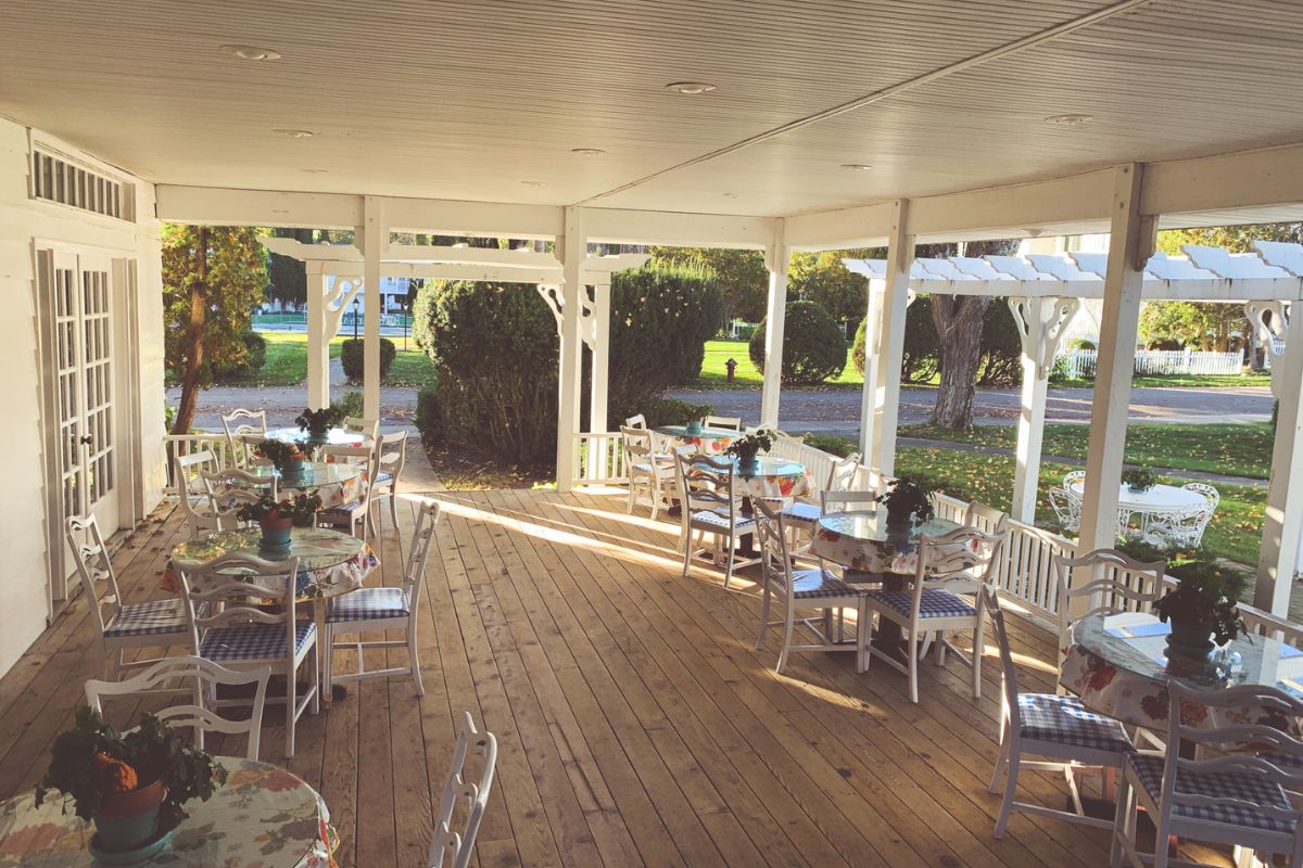 a patio with tables and chairs