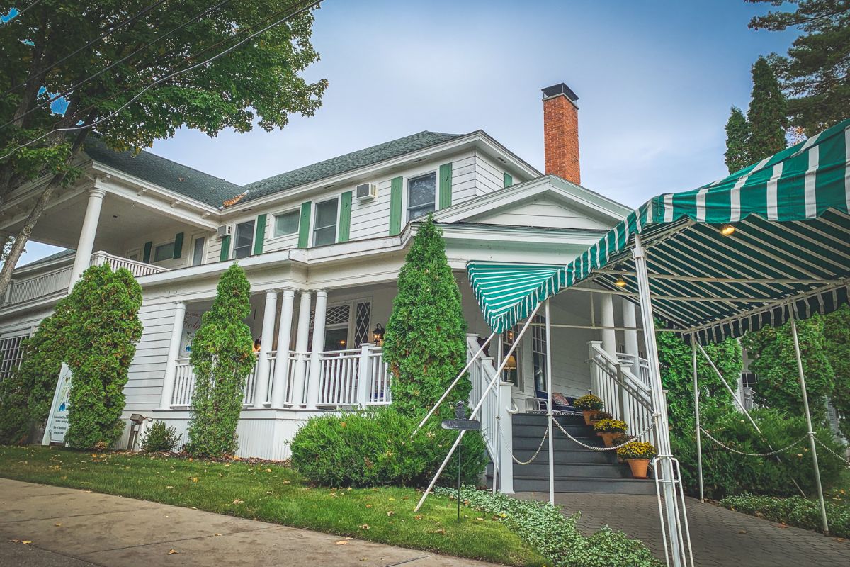 a house with a green awning