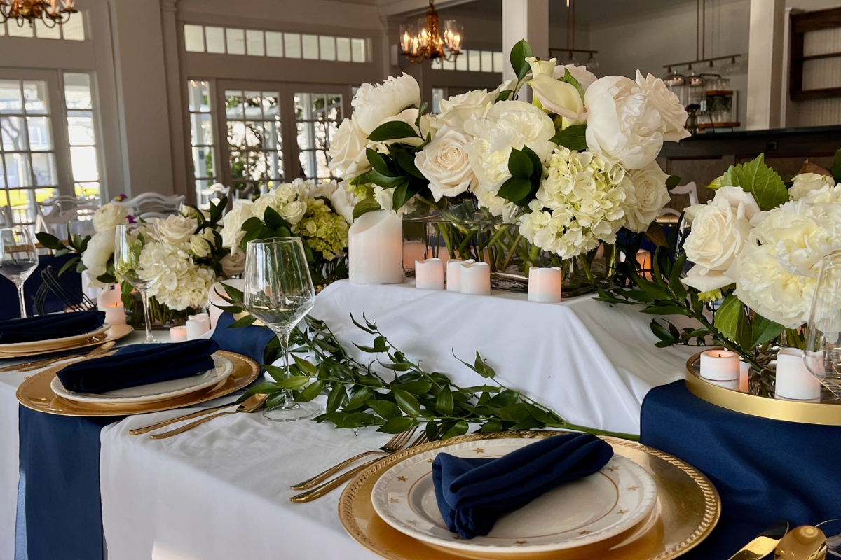 a table set with flowers and candles