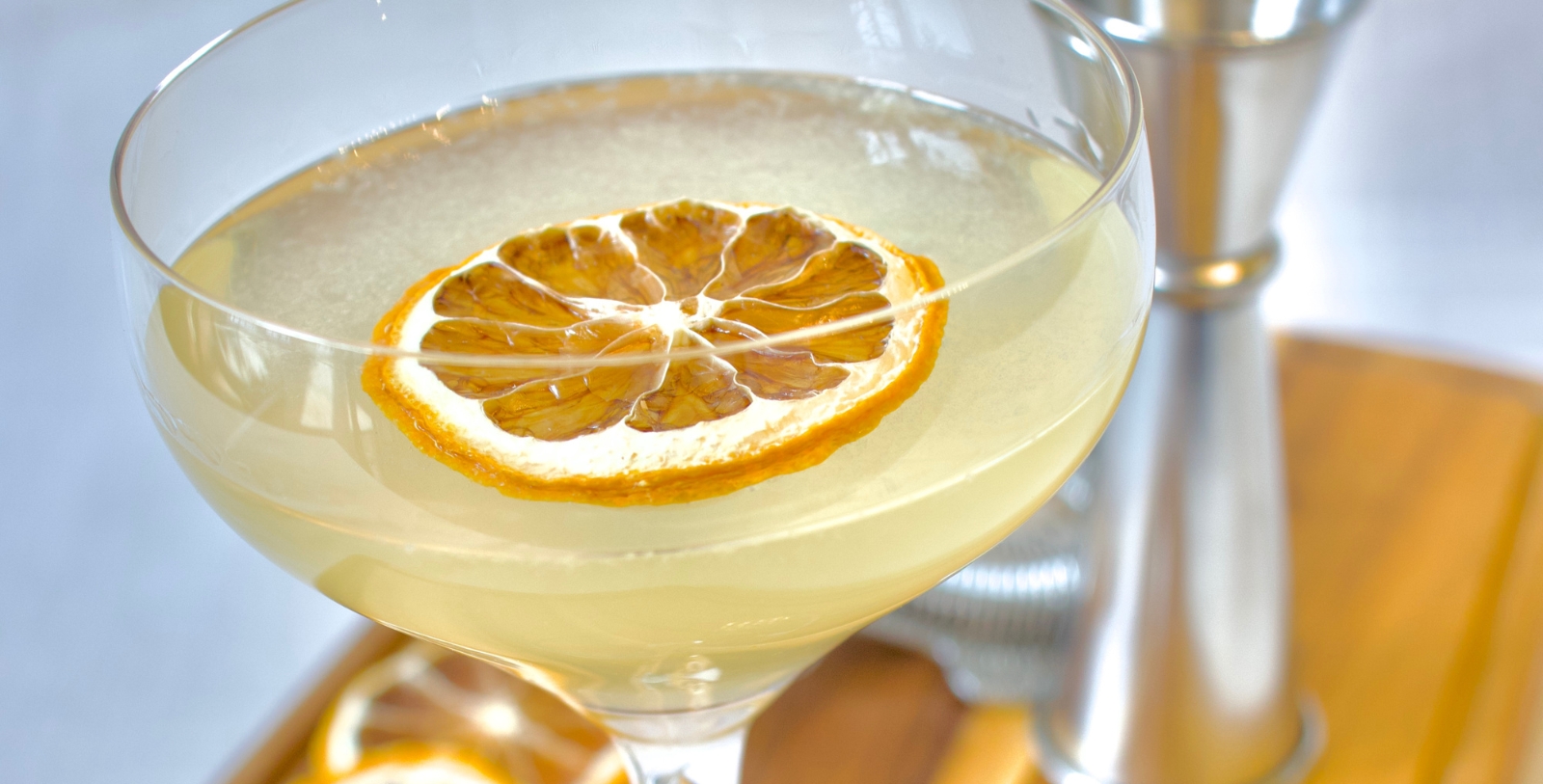 a glass with a slice of lemon on top