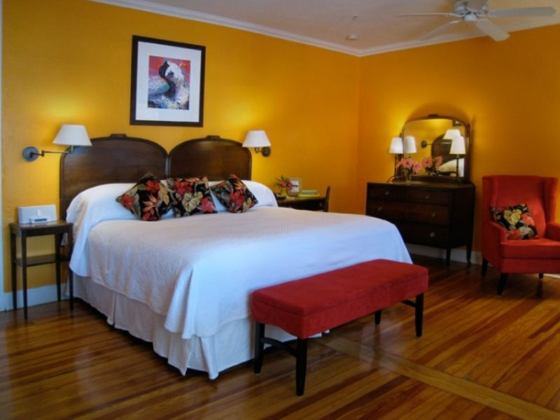 a bedroom with a bed and a bench