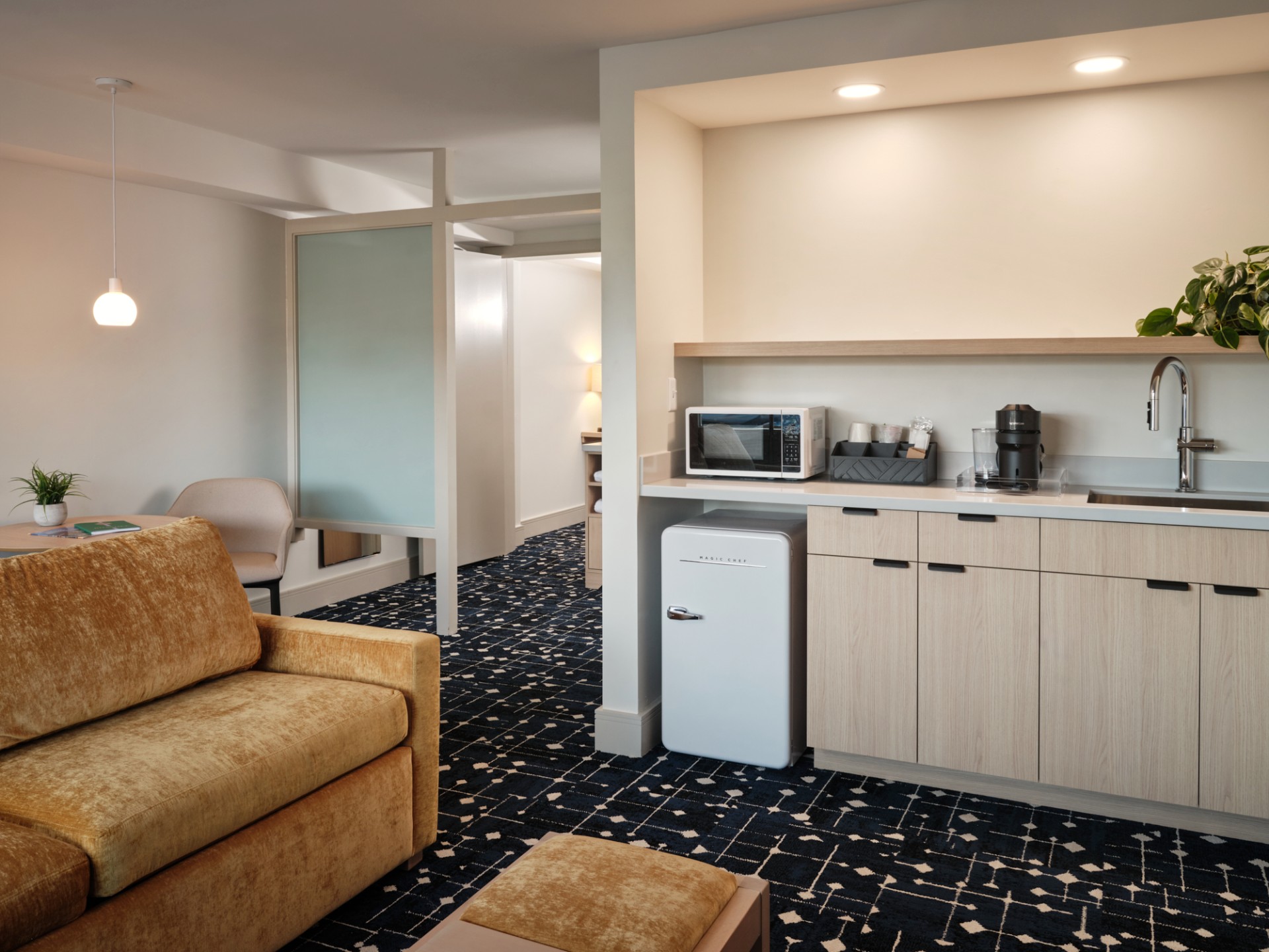 a room with a couch and a microwave