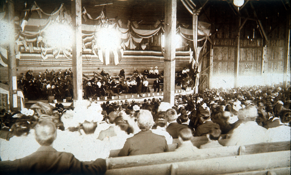a group of people sitting in a stage