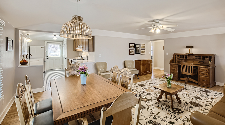 a dining table and chairs in a living room