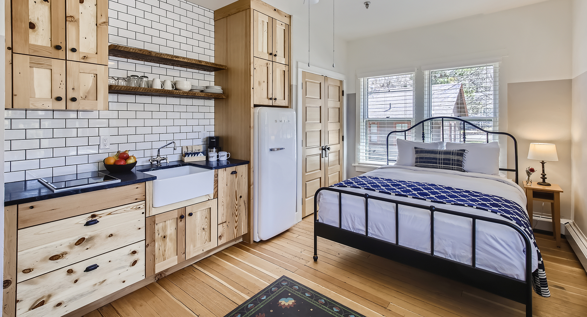 a bedroom with a bed and a sink
