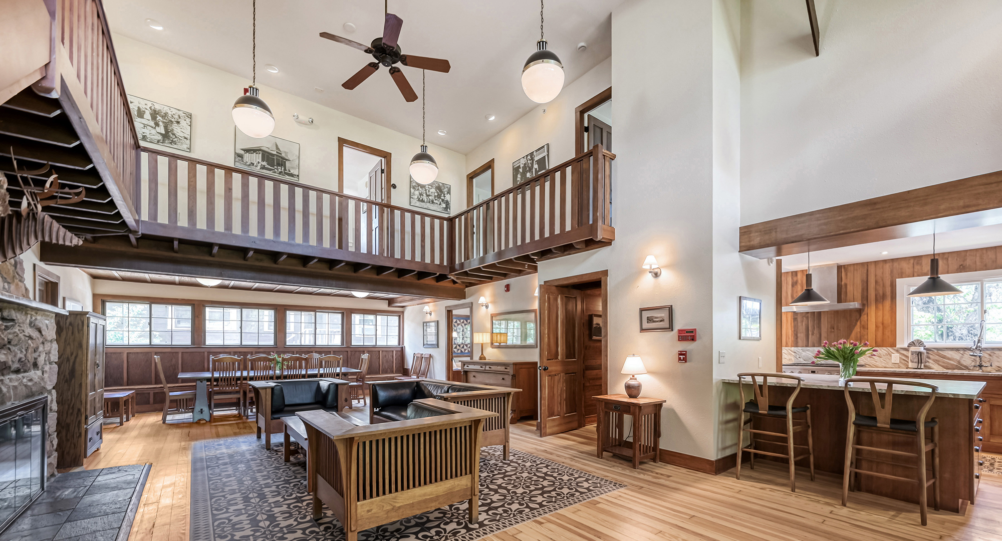 a room with a couch and a ceiling fan