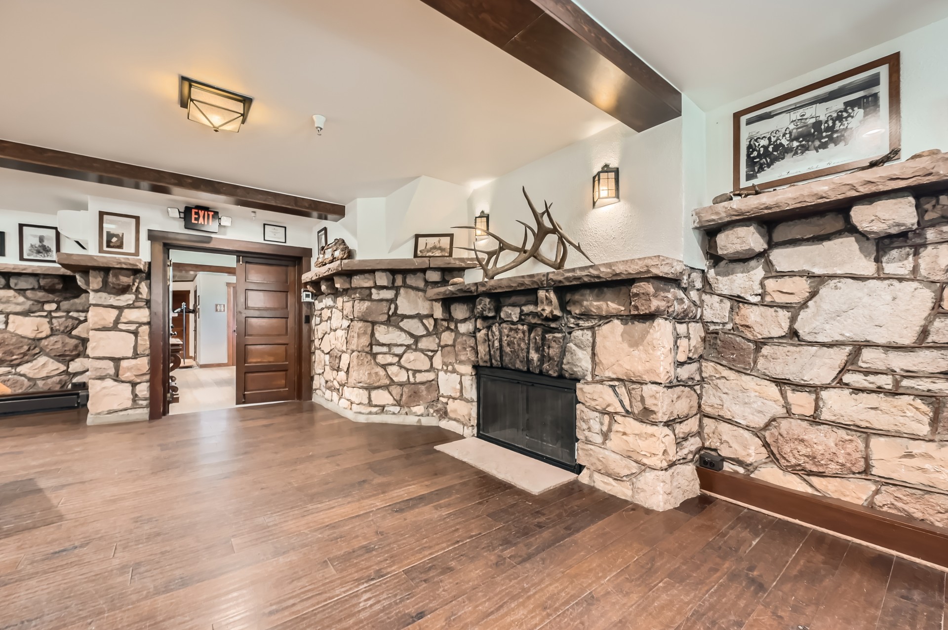 a room with a fireplace and a wood floor