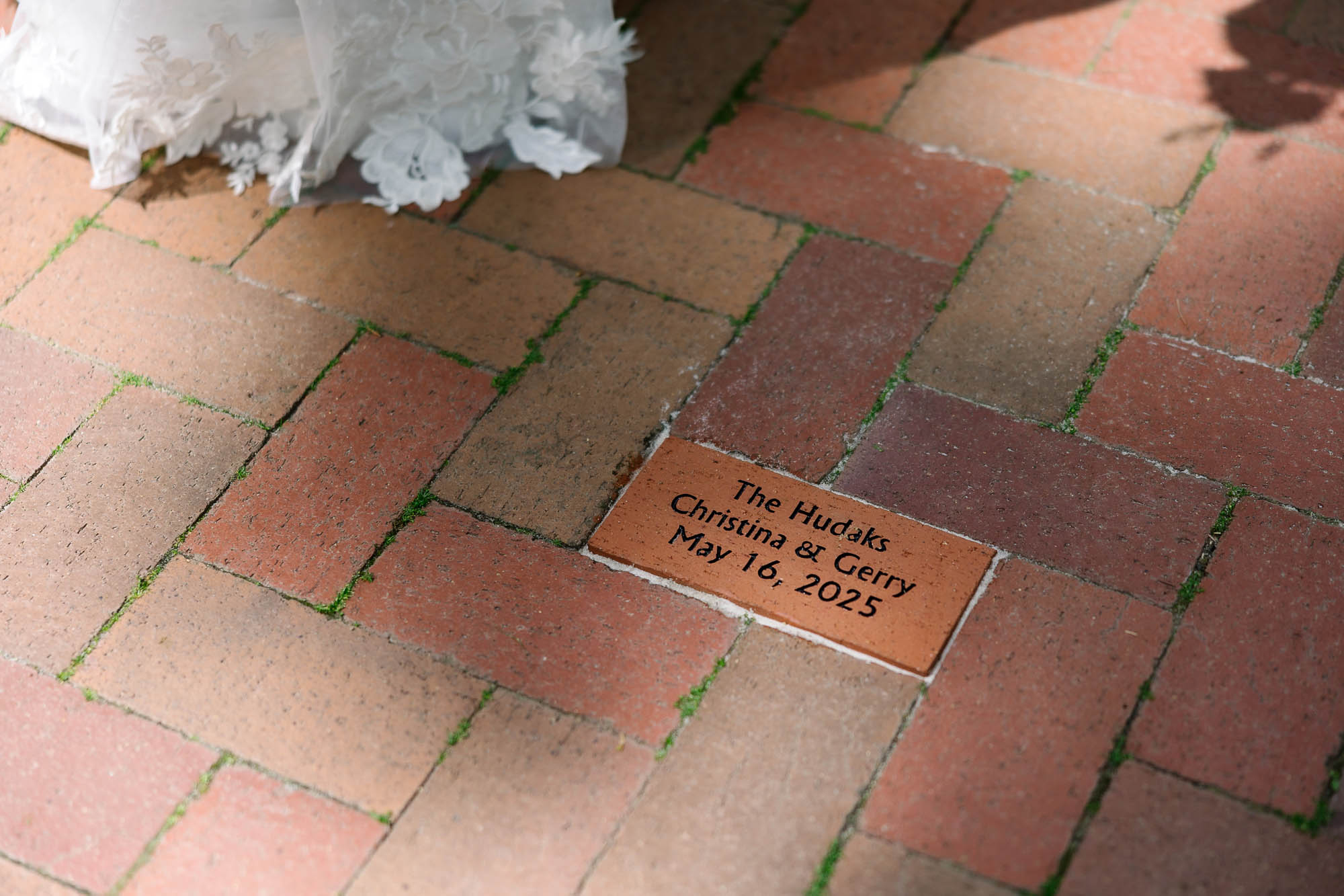 a brick plaque on a brick floor