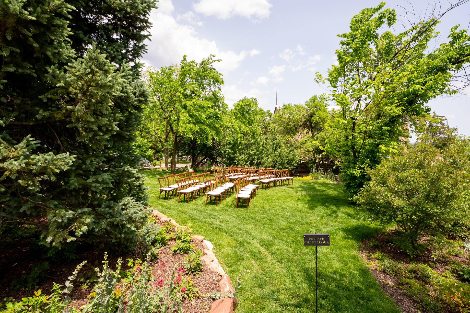 a group of chairs in a grassy area