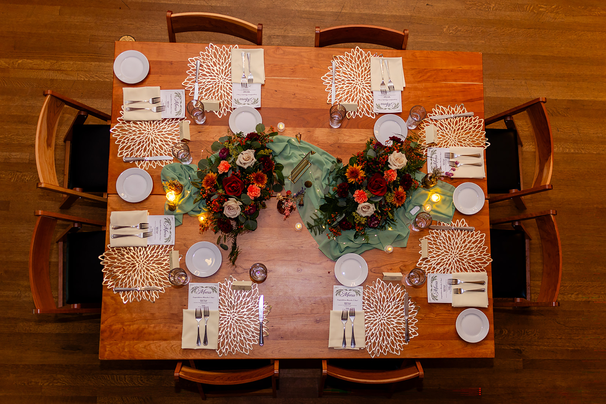 a table with flowers and plates