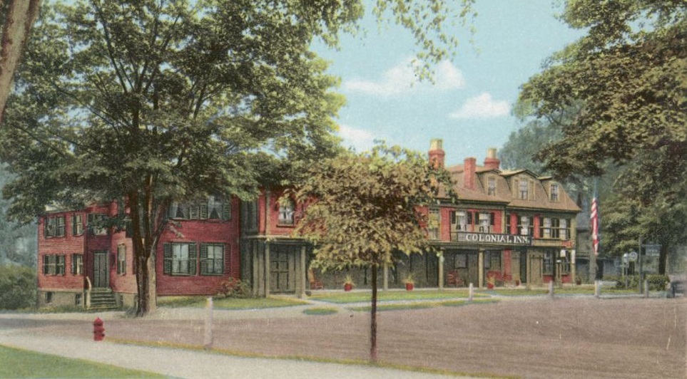 a building with trees and a street