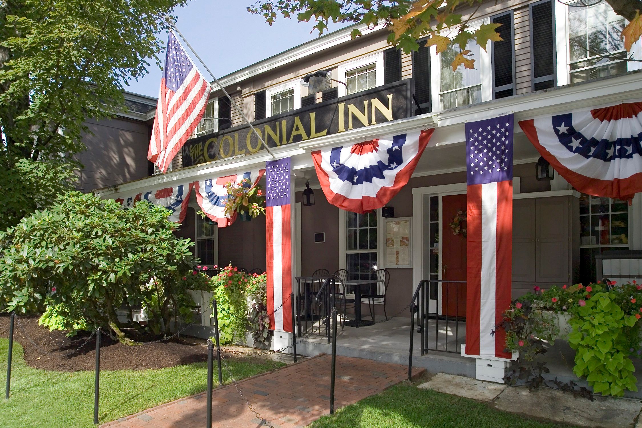 a building with flags and a sign