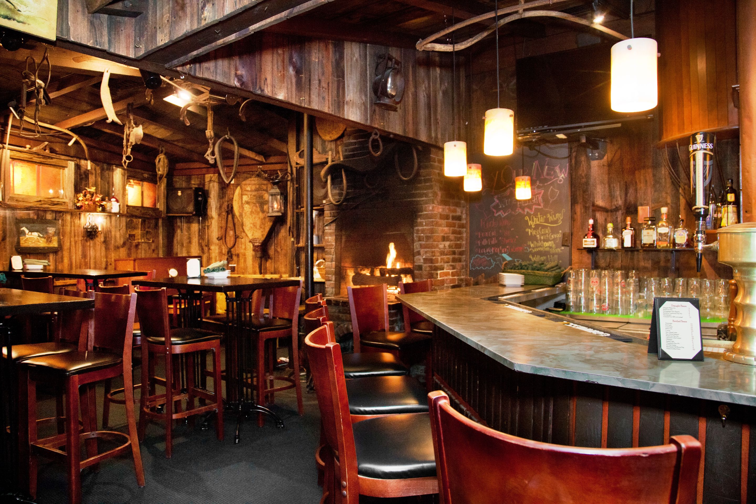 a bar with chairs and tables