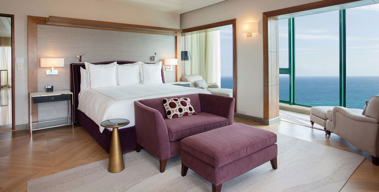 a bedroom with a bed and purple furniture