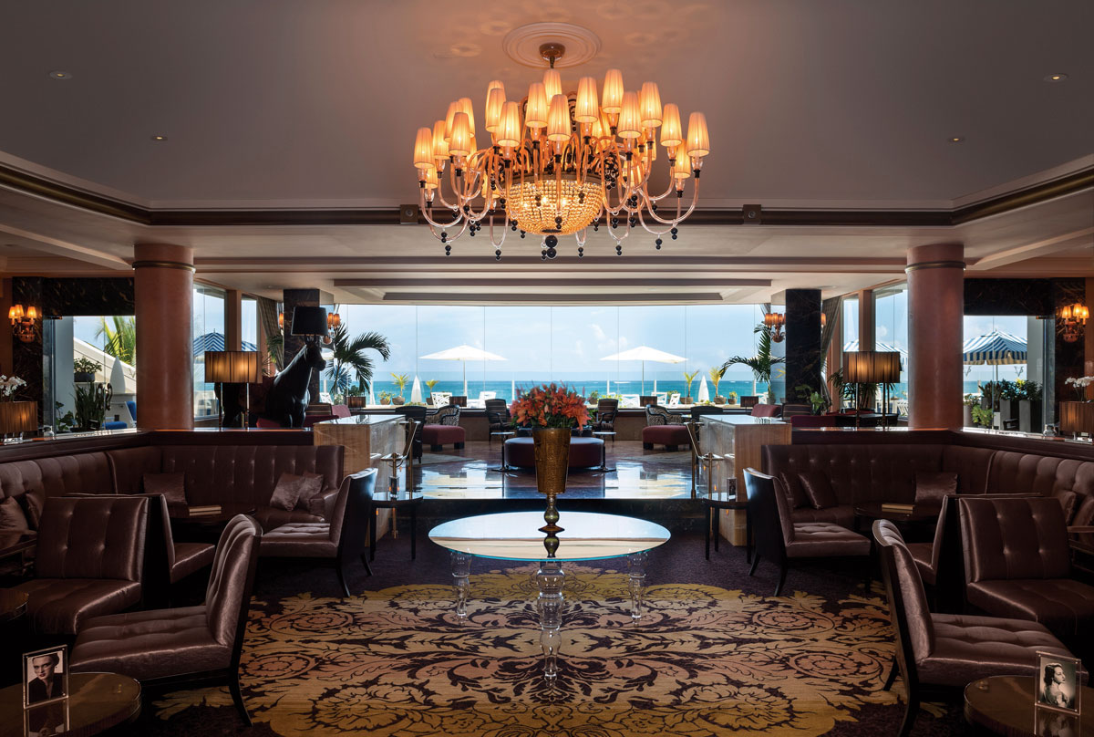 a room with a chandelier and chairs