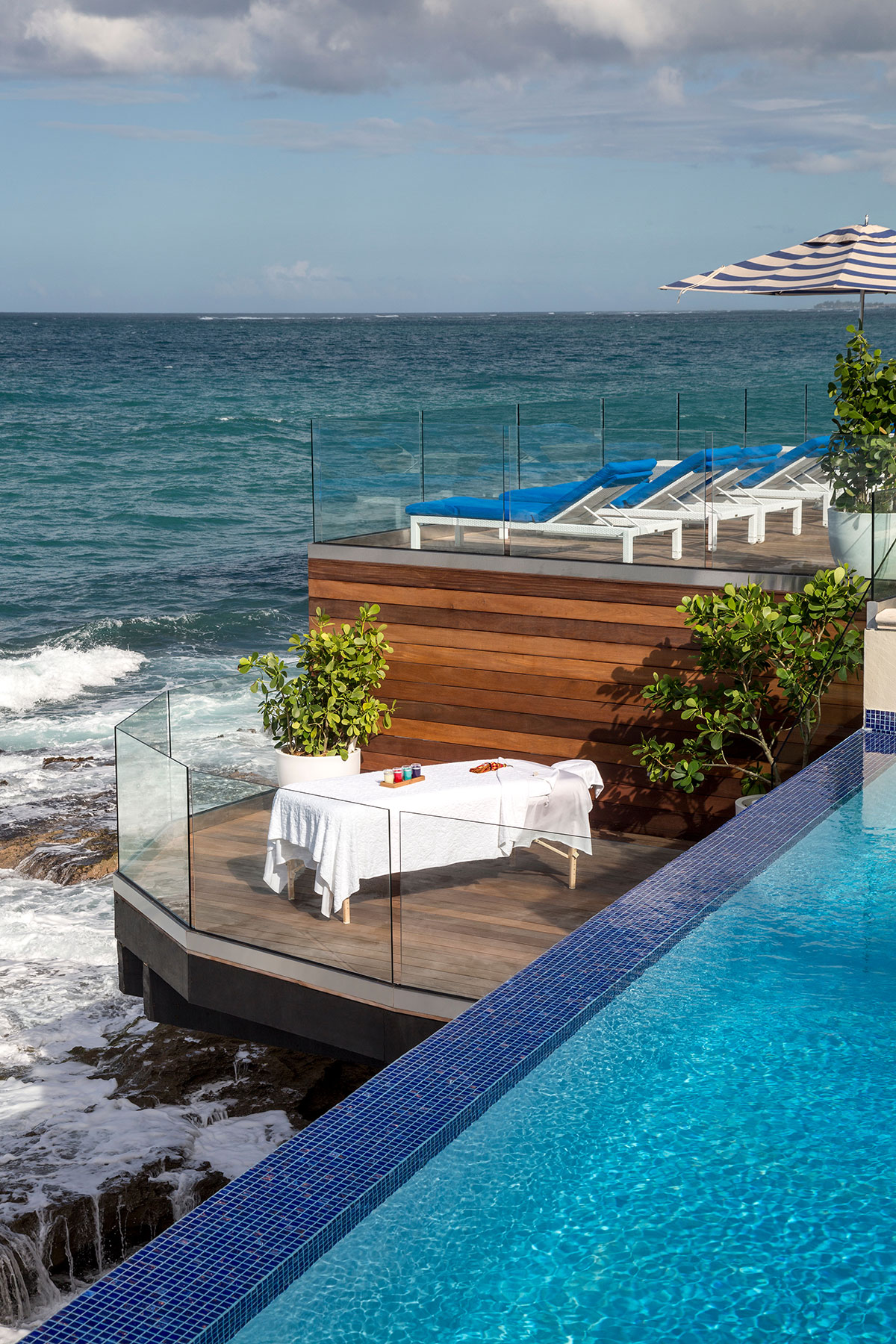 a pool with a table and chairs by it