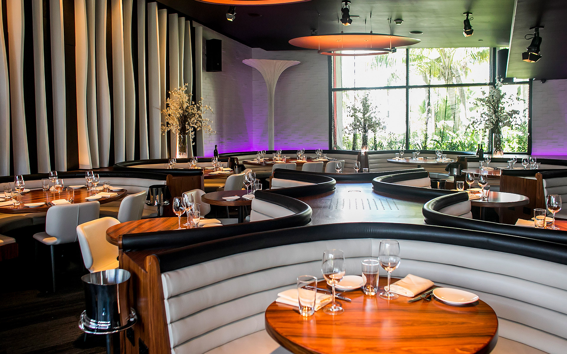 a restaurant with tables and chairs
