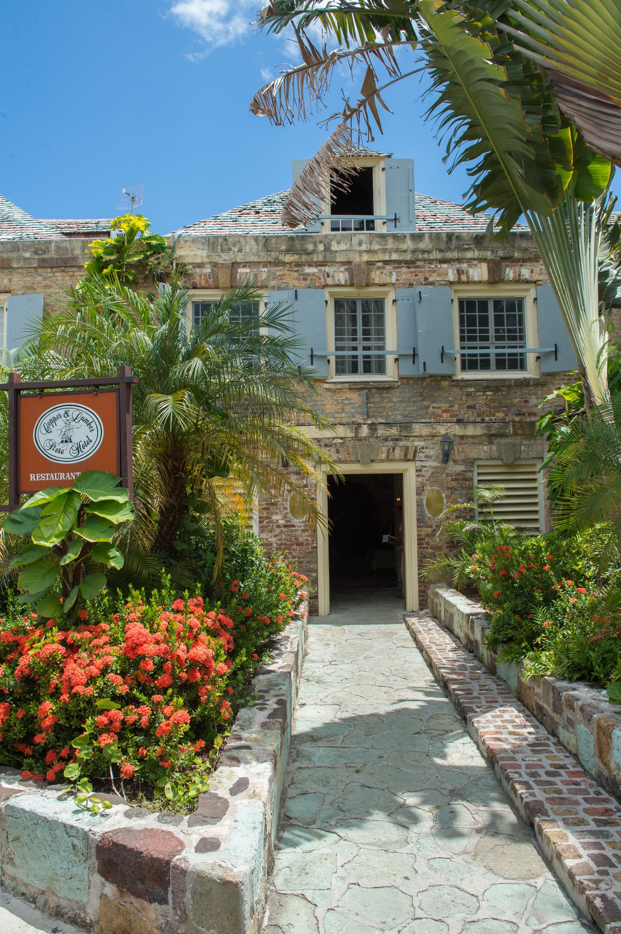 image of exterior entrance copper and lumber store historic inn english harbour antigua and barbuda_high