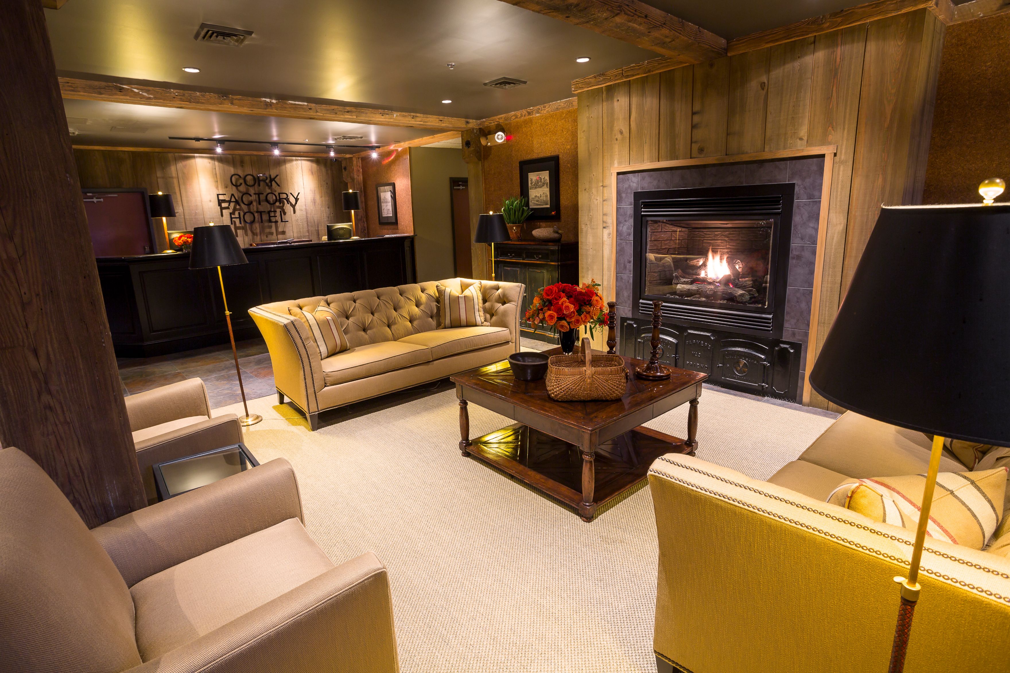 a room with a fireplace and couches