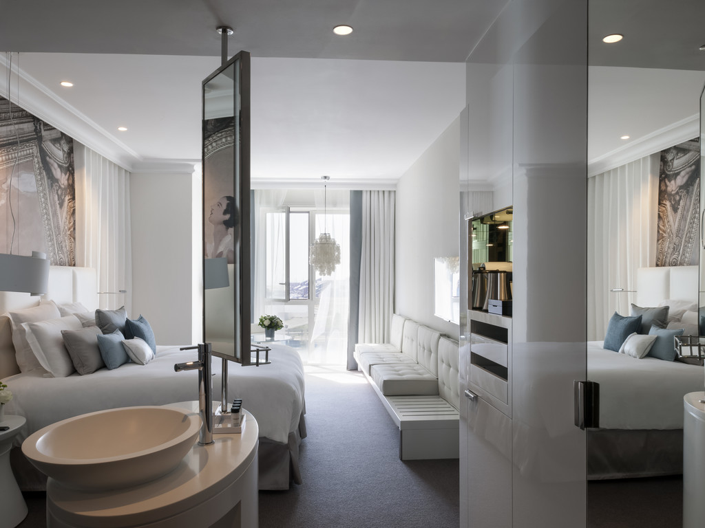 a bedroom with a bed and a sink
