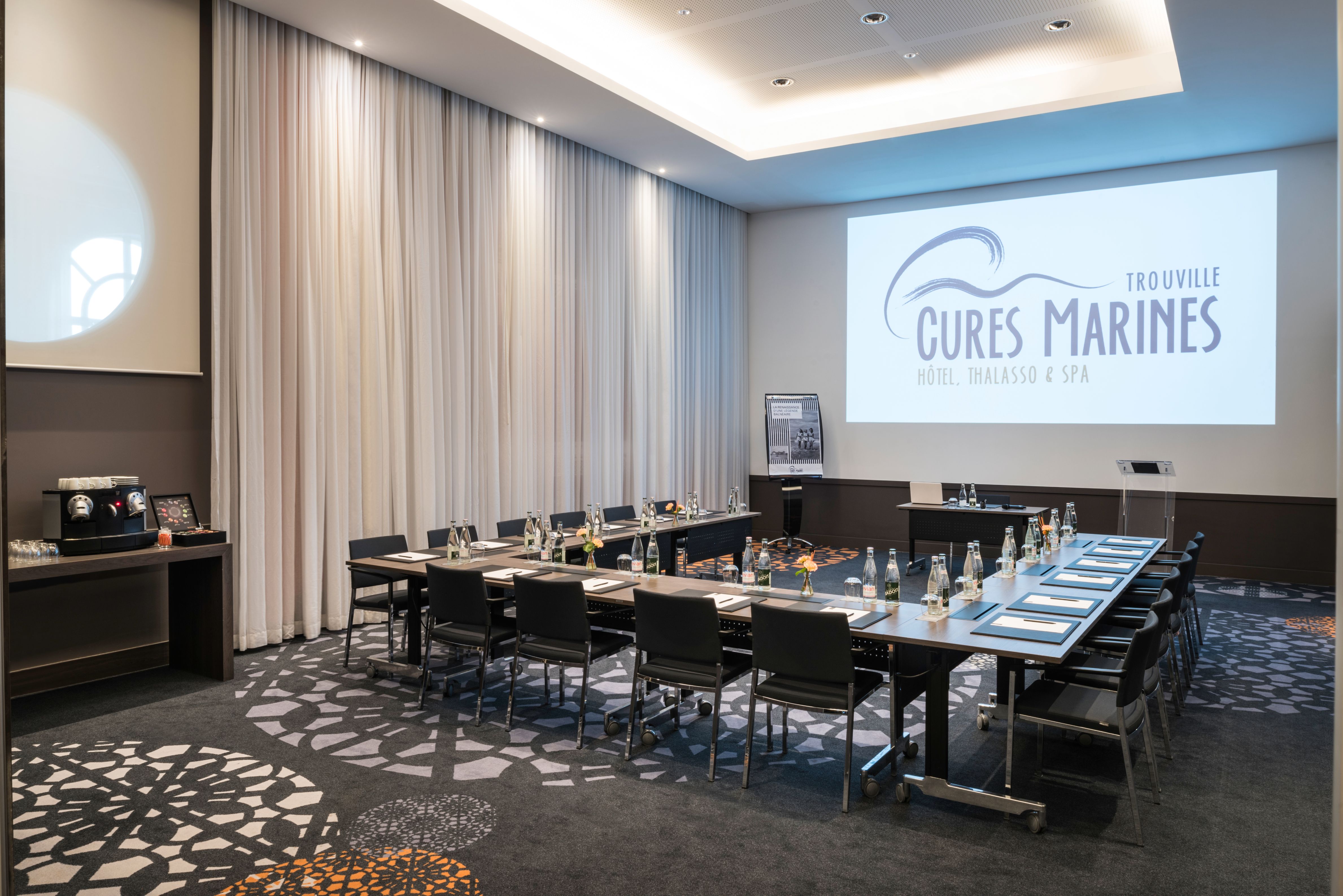 a room with a large table and chairs
