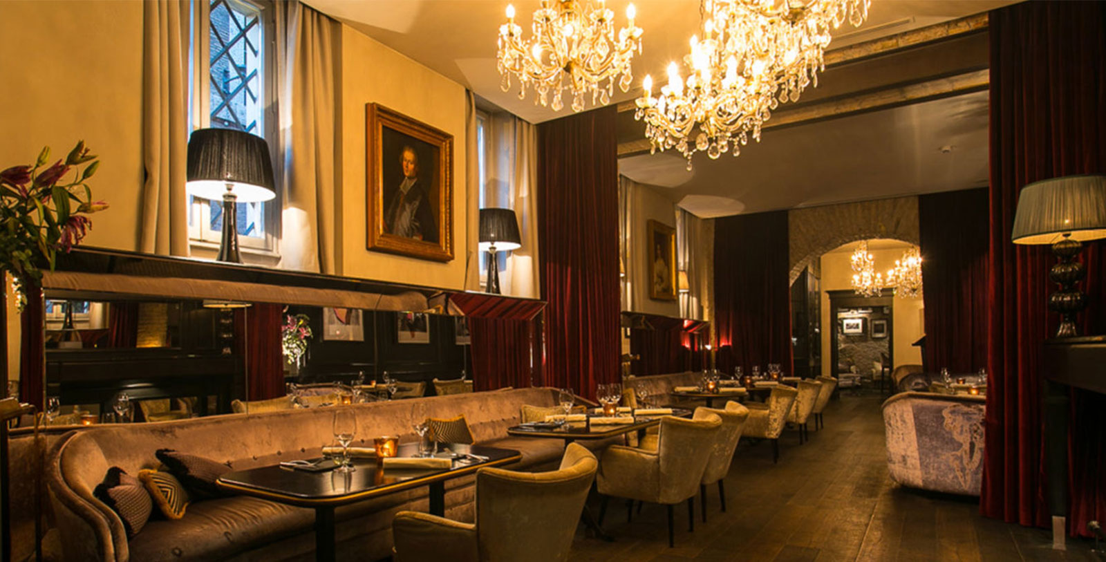 a restaurant with chandeliers and tables