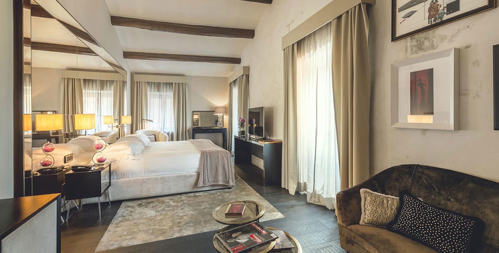 a bedroom with a bed and a television