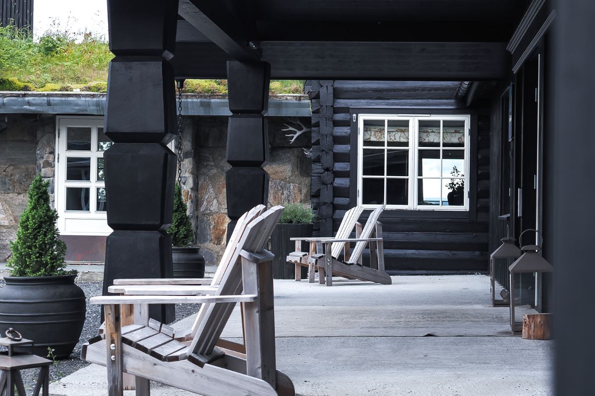 a wooden chairs on a porch