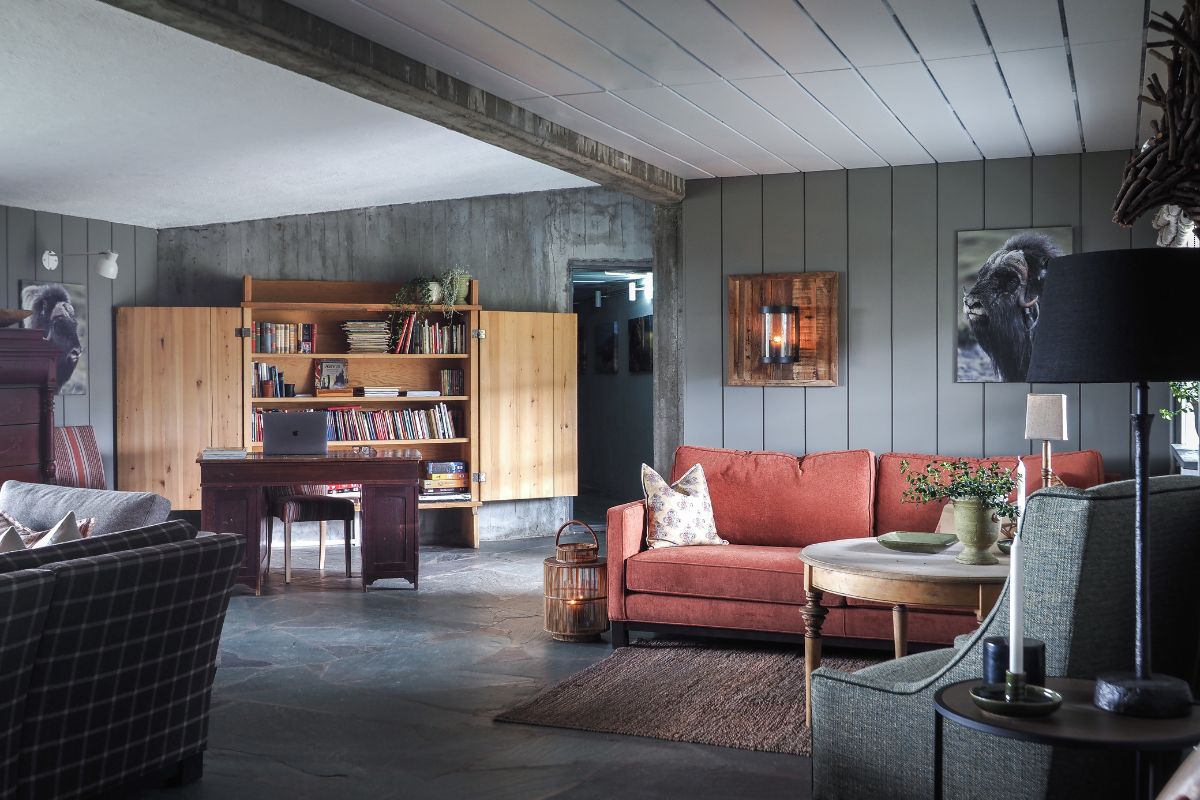 a living room with a couch and a bookcase