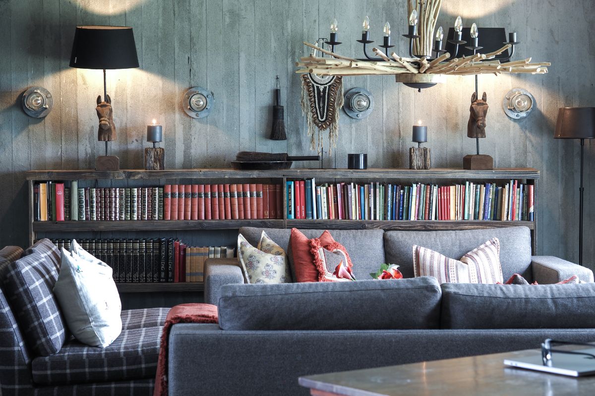 a room with a couch and bookshelf