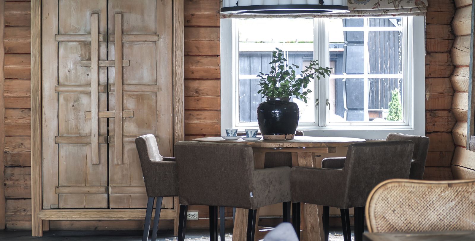 a table with chairs and a plant on it