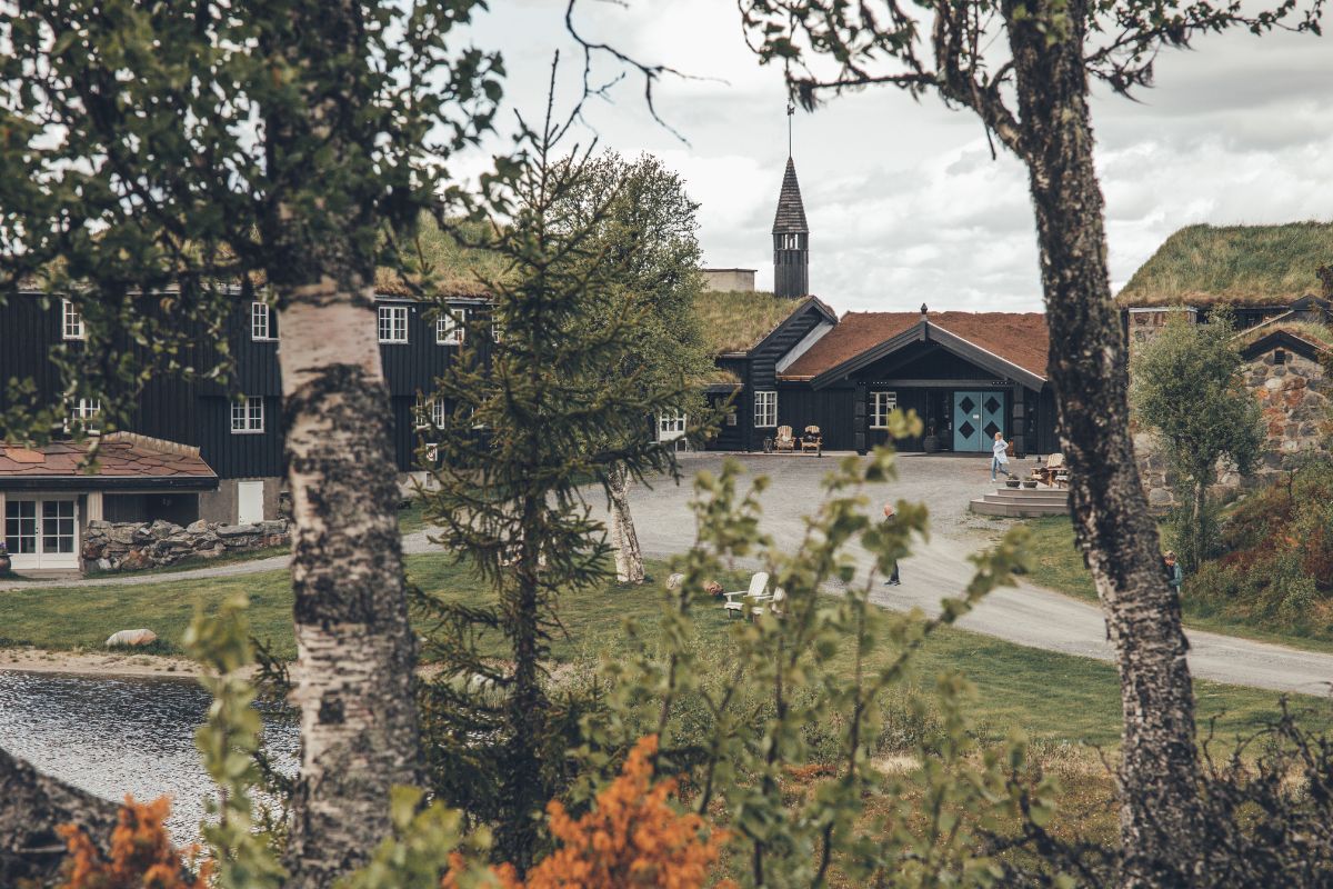 a building with a steeple and trees