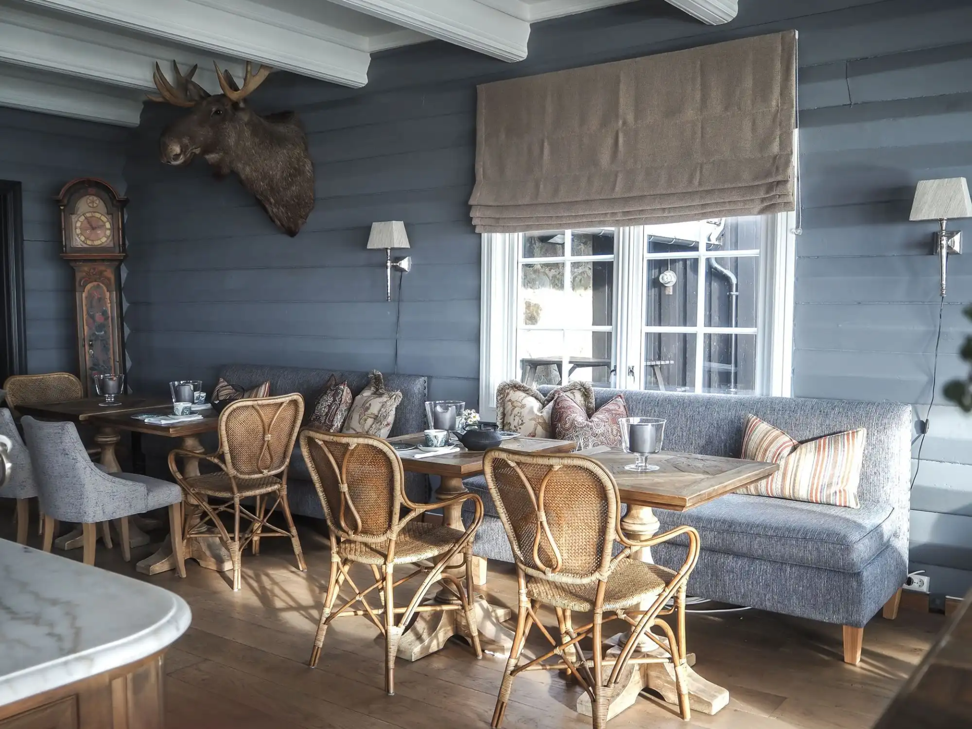a room with a couch and tables