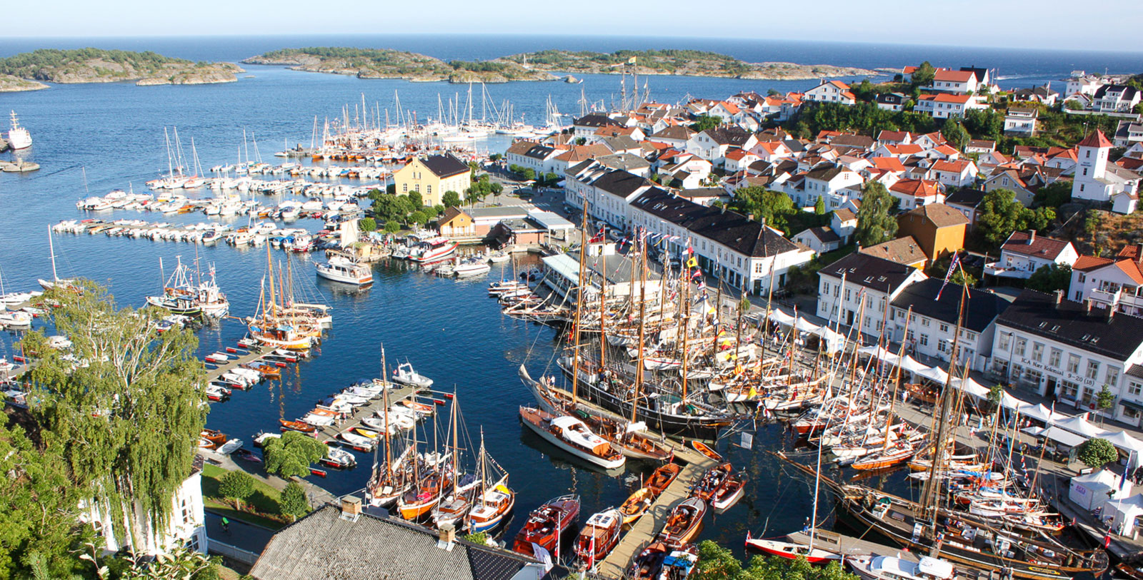 a harbor with many boats and buildings