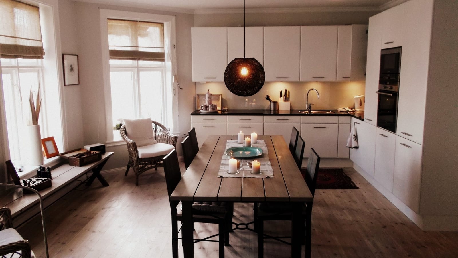 a kitchen with a table and chairs