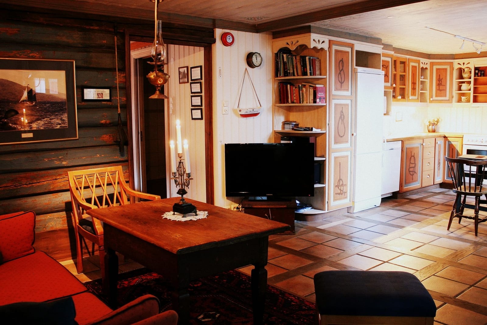 a living room with a table and chairs