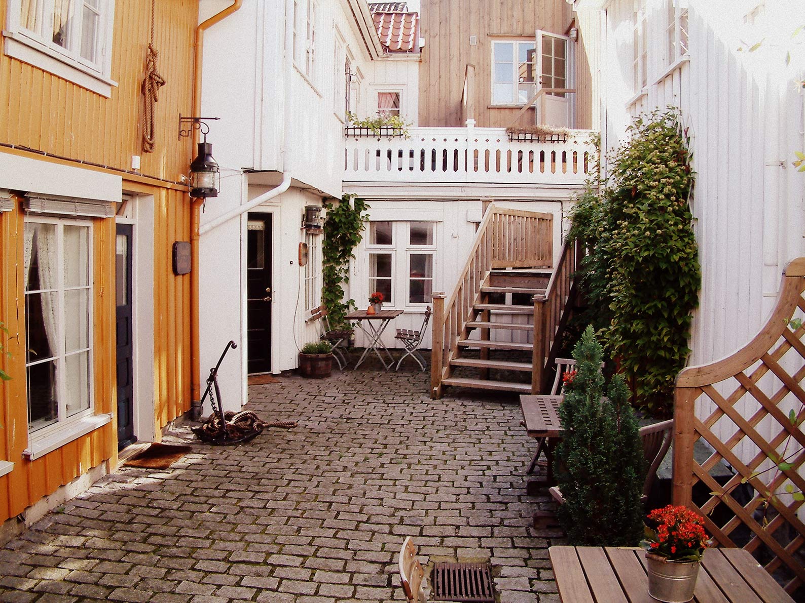 a courtyard with a patio and stairs