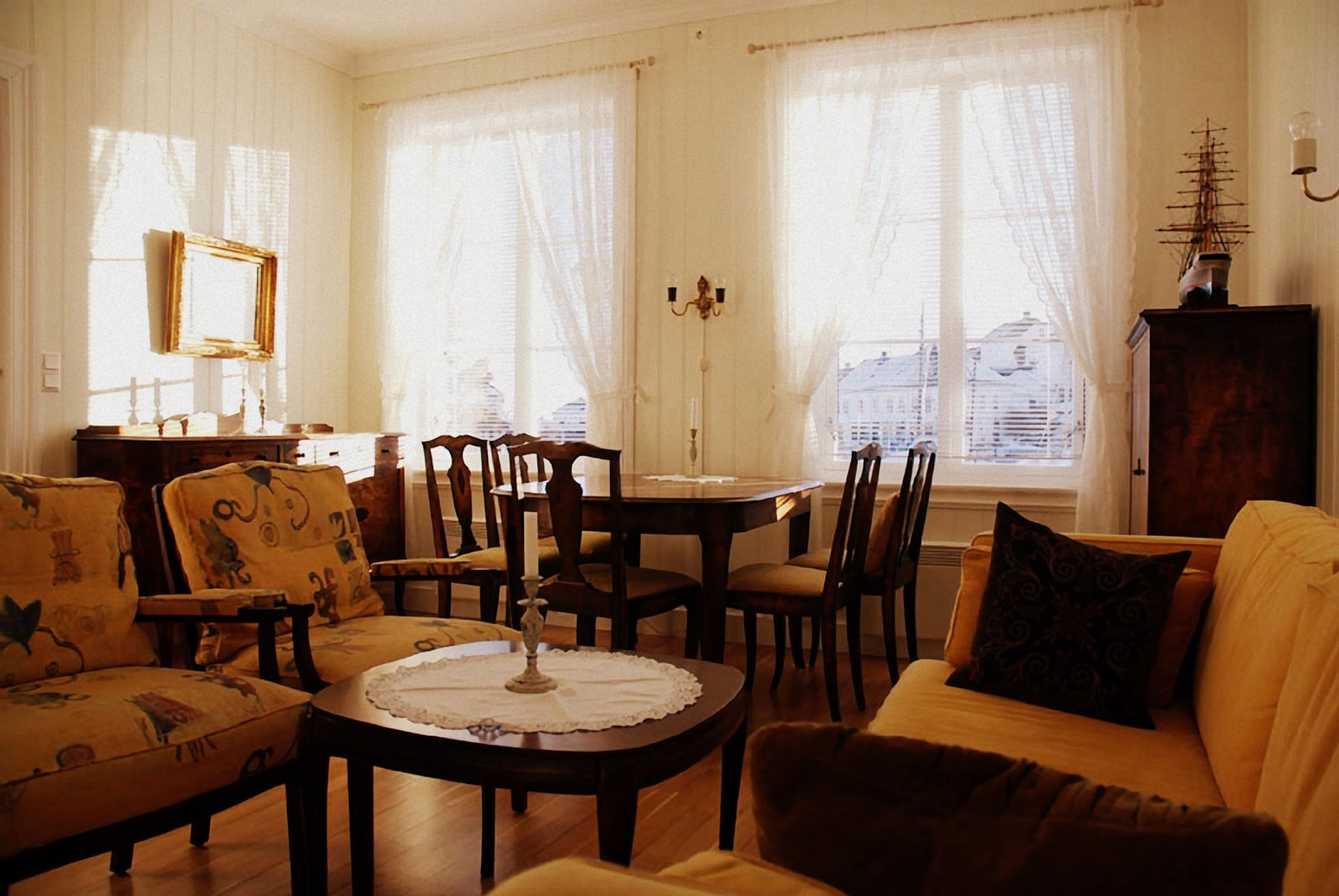 a living room with a table and chairs