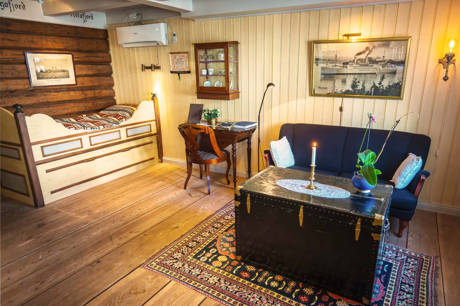 a room with a couch and a desk