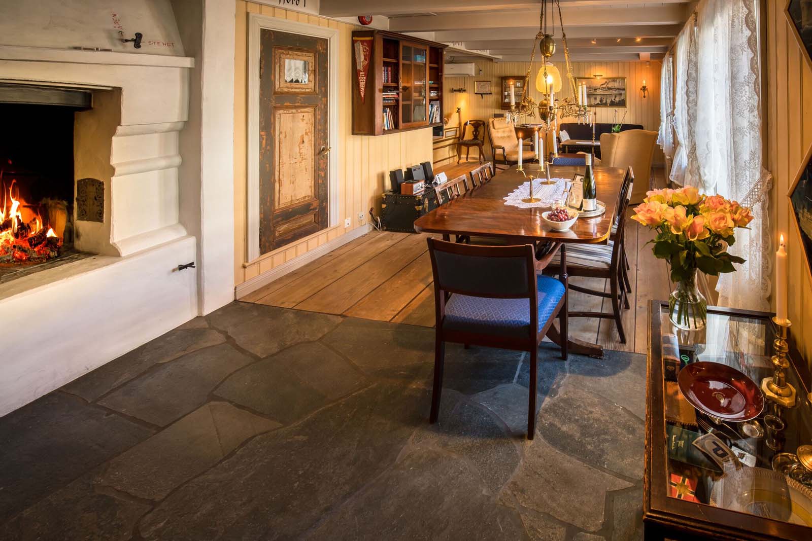 a dining room with a table and chairs