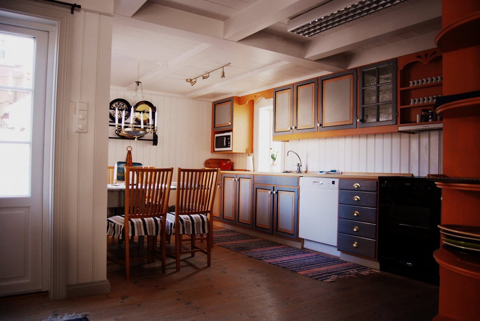 a kitchen with a table and chairs