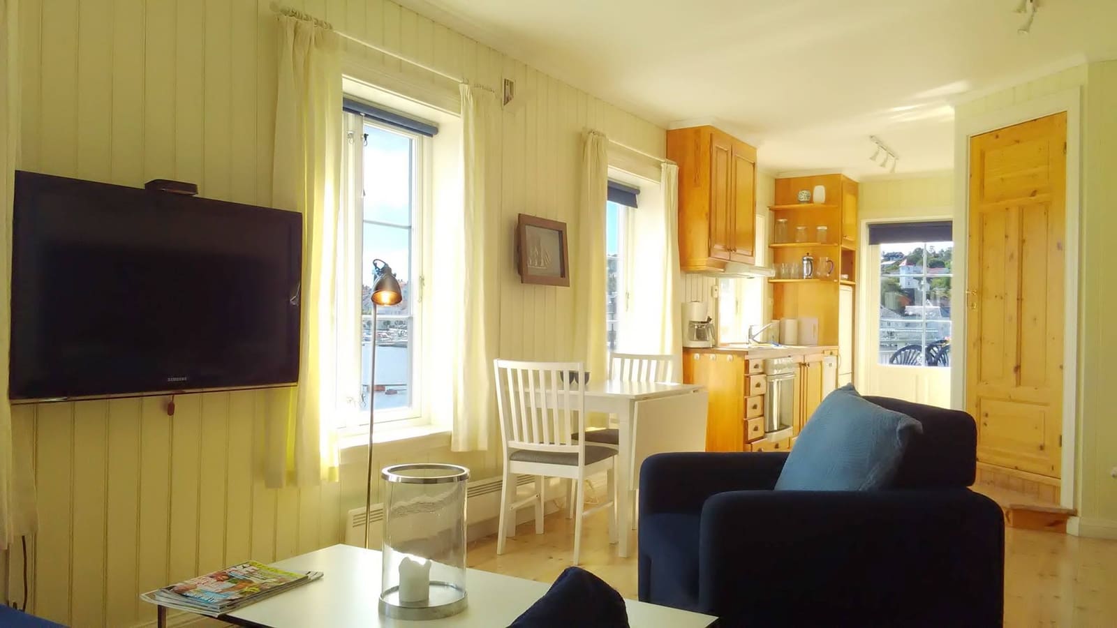 a living room with a tv and a table