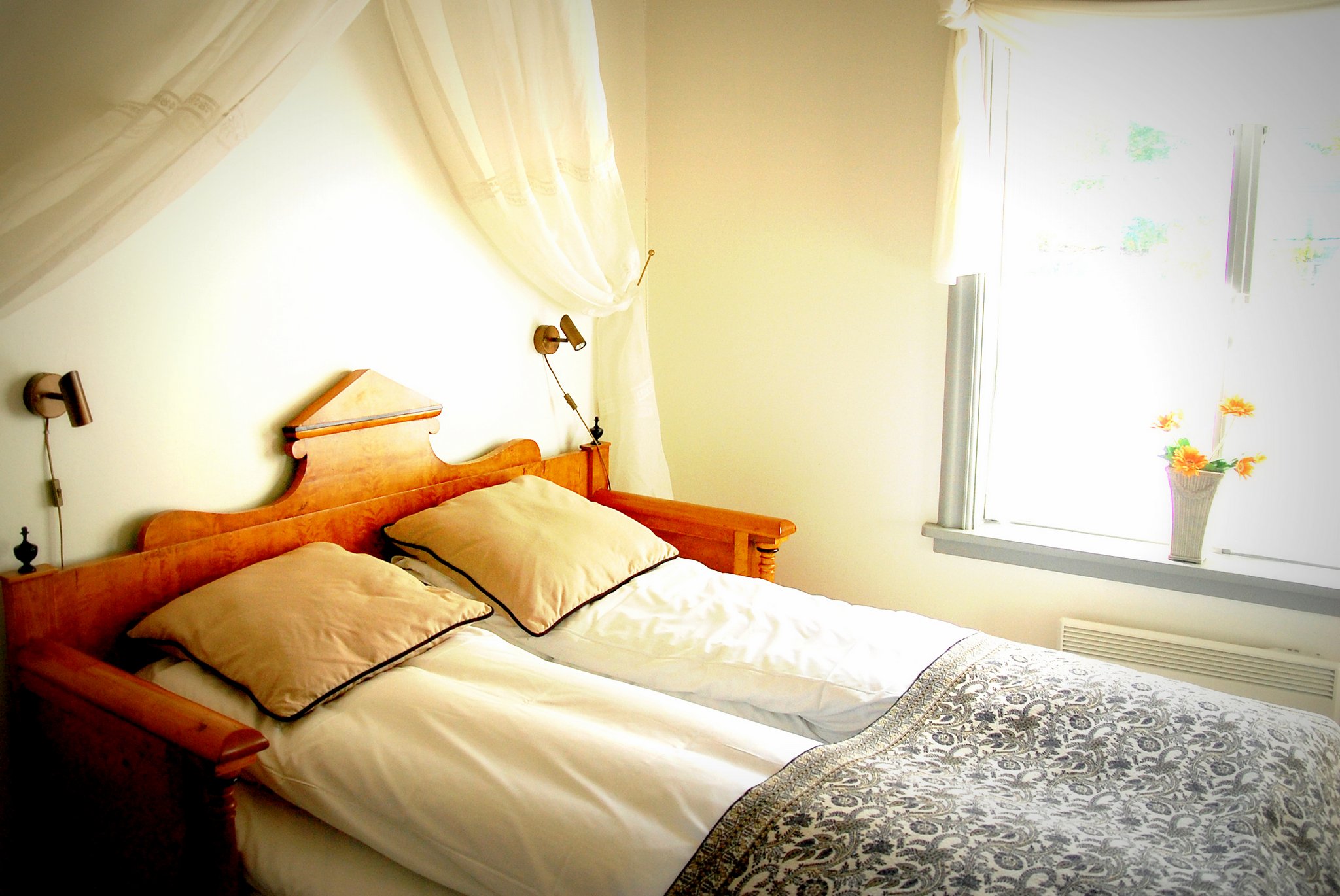 a bed with pillows and a canopy over it