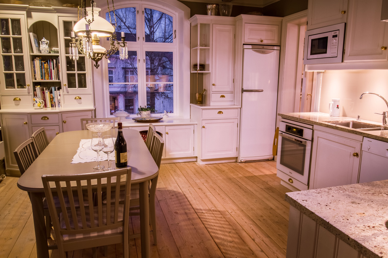 a kitchen with a table and chairs
