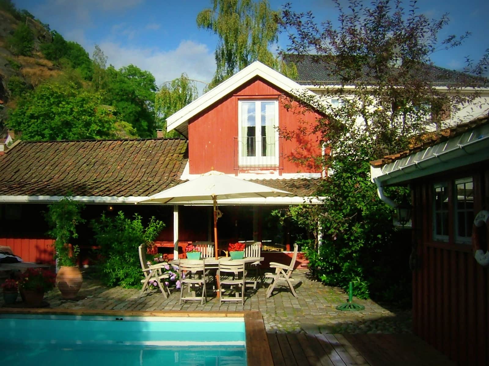 a house with a pool and a table