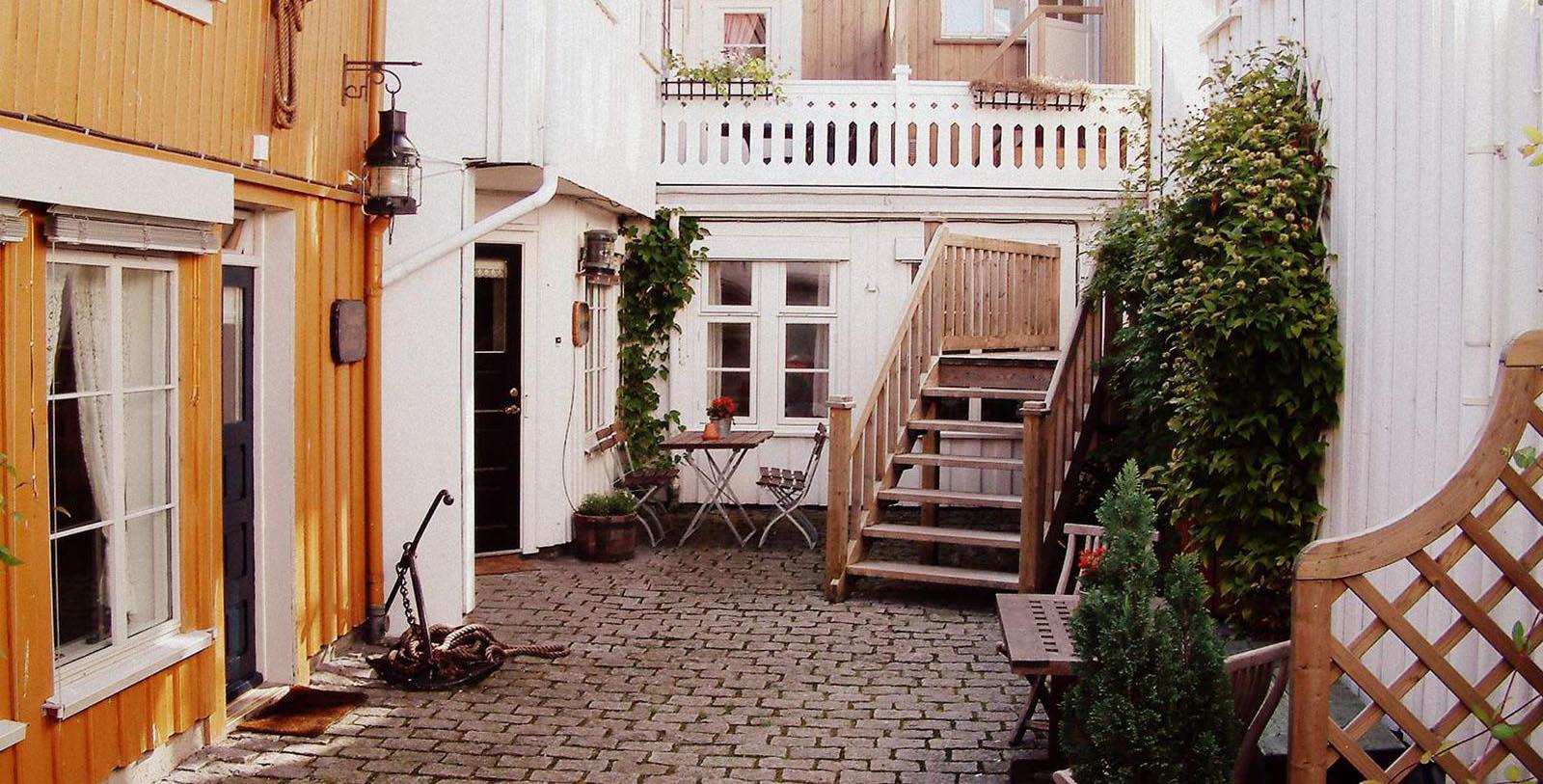 a patio with a table and chairs