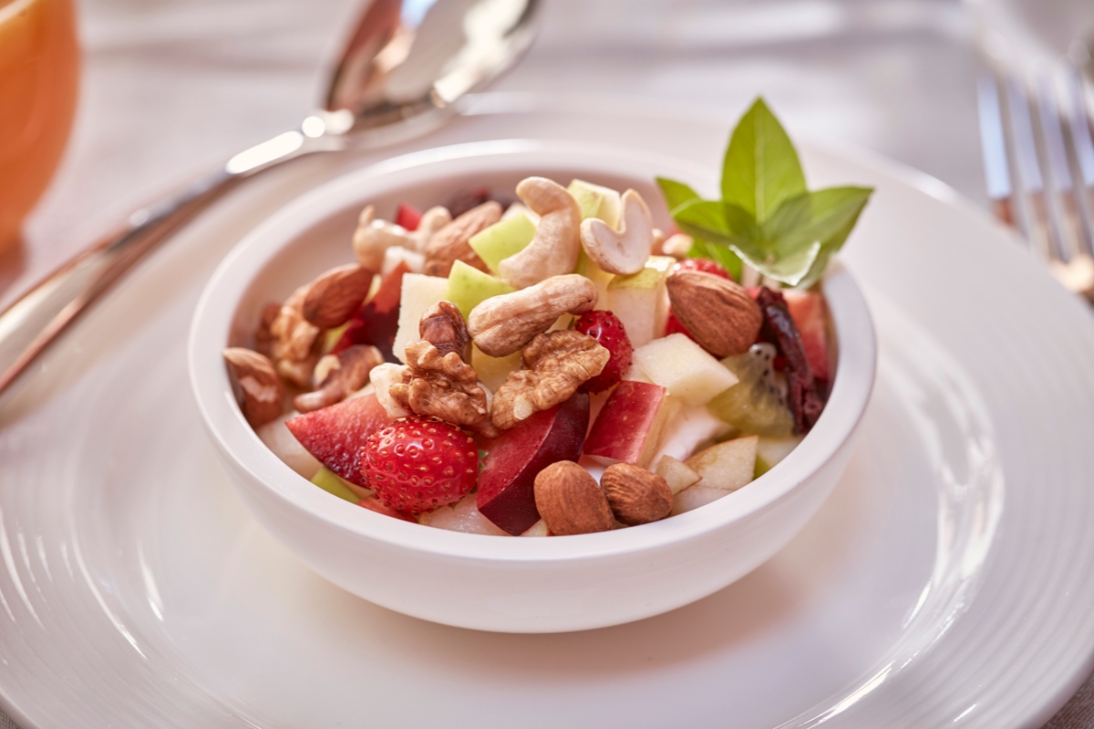 a bowl of fruit and nuts